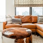 Spacious family room featuring custom draperies and blinds, adding warmth and style to the space.