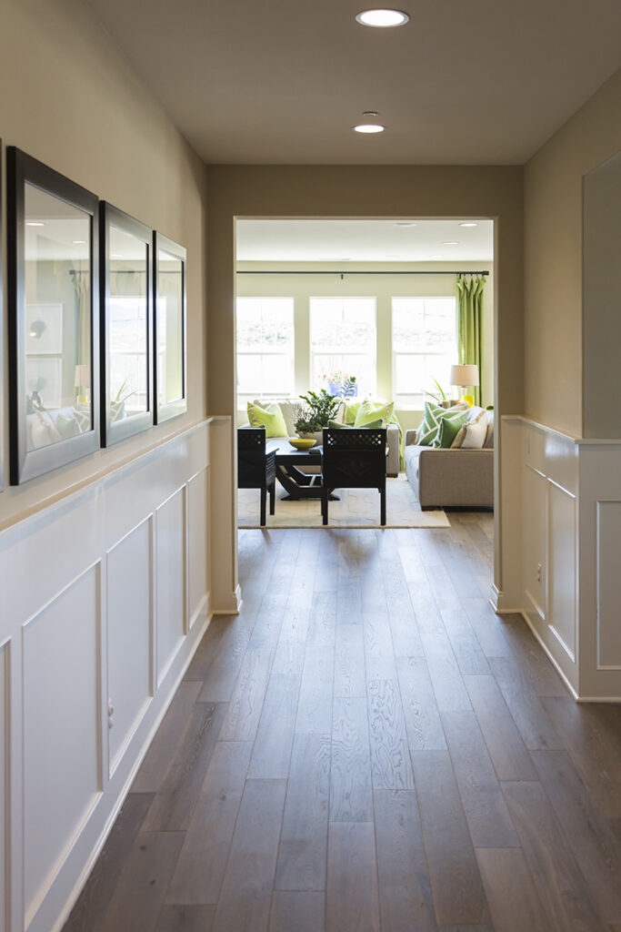 Detailed wood wainscoting on a beautiful denver colorado home entry way with wood floors adding depth and character to a space