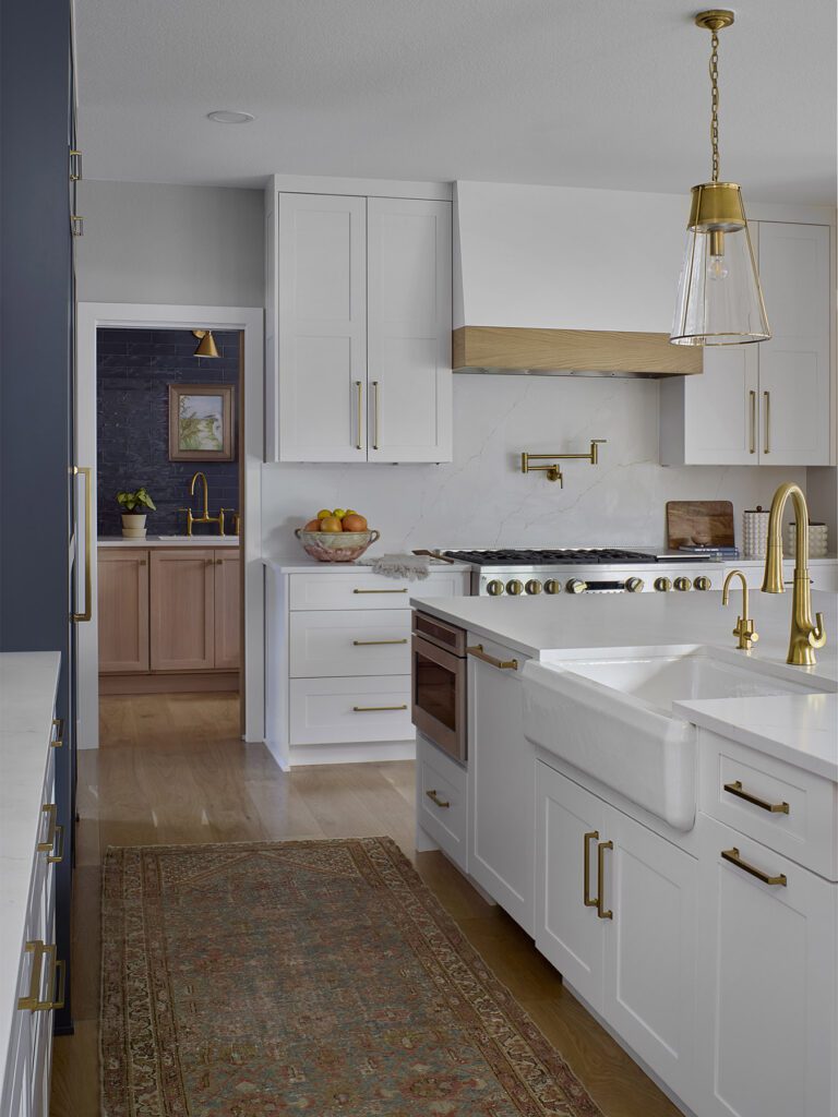Open concept kitchen remodel in Littleton with custom cabinetry and hidden walk-in pantry