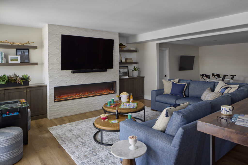 Basement rec room remodel in Littleton with integrated storage and open layout