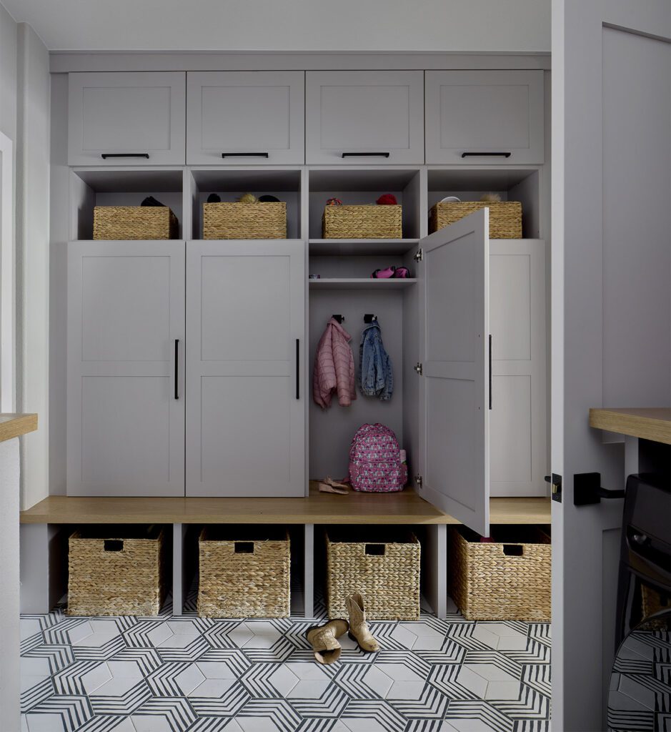 Mudroom remodel with dog shower and built-in drop zones in family-friendly Littleton home remodel by Denver Design Group