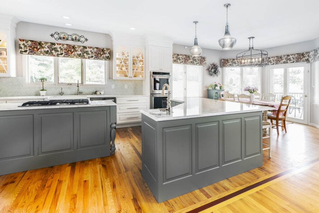 Littleton French country kitchen with dual islands, prep sink, and custom storage, design and remodel by Denver Design Group