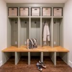 Efficient mudroom with custom cabinetry and organized storage zones laundry/mudroom remodel with utility sink and built-ins