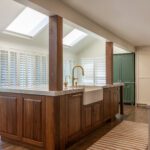 Remodeled Denver kitchen with large island seating for six and quartzite countertop