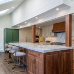 Remodeled Denver kitchen with large island seating for six and quartzite countertop