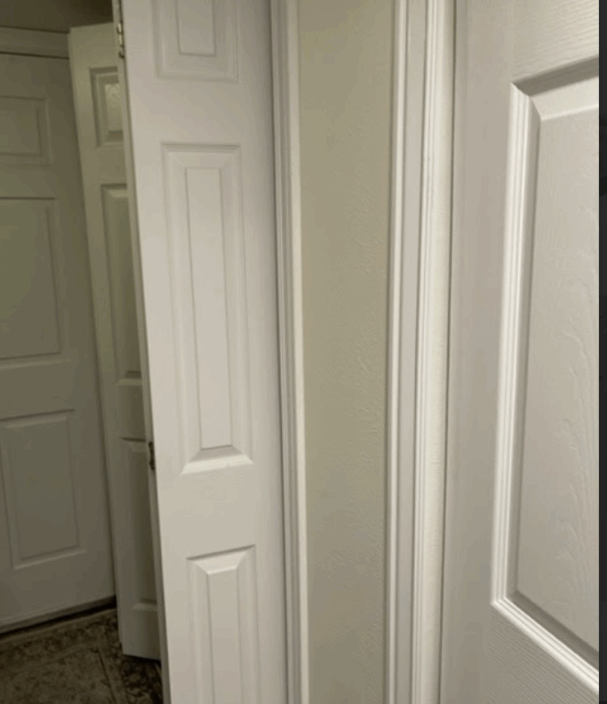Laundry room without cabinetry or drop zone prior to renovation