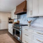 Open concept kitchen with walk-in pantry, luxury appliances, and Matarazzo quartzite