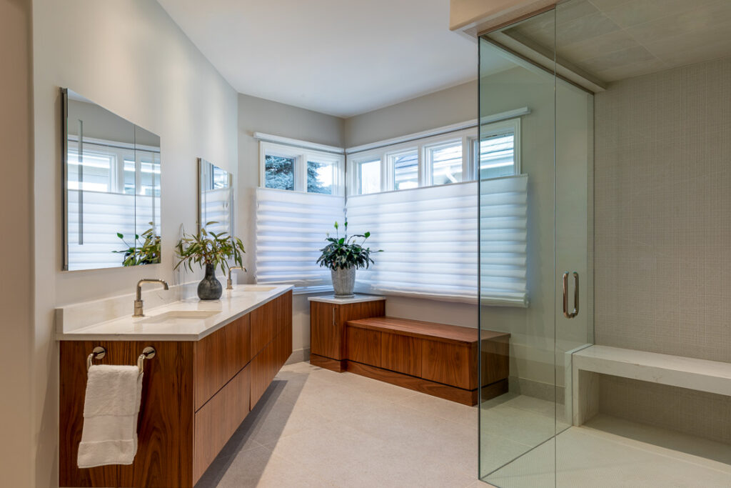 Primary bathroom remodel with curbless steam shower and heated floors in Greenwood Village by Denver Design Group