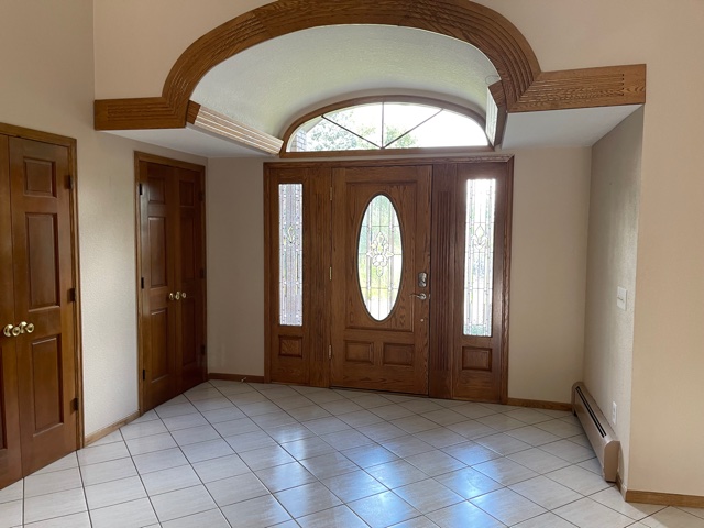 Before remodel showing dated entry way and and limited flow