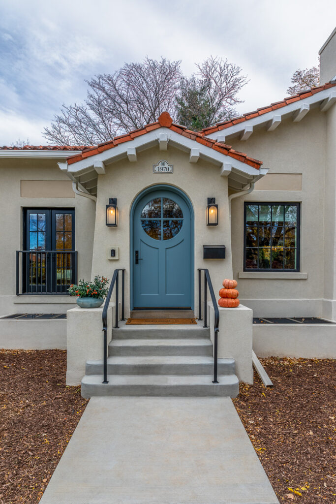 Park Hill Denver Spanish Colonial Revival Remodel blue front door stucco exterior terracotta roof tiles by Denver Design Group
