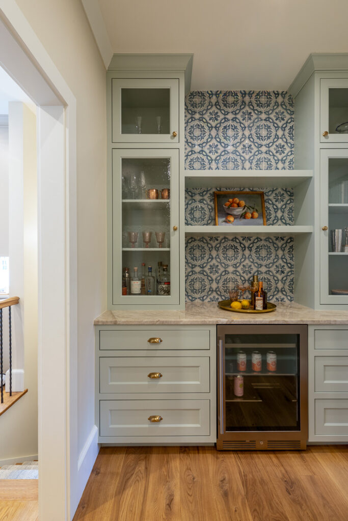 Butler's pantry and bar with Spanish Colonial tile and robins egg blue cabinetry in Park Hill Denver remodel by Denver Design Group