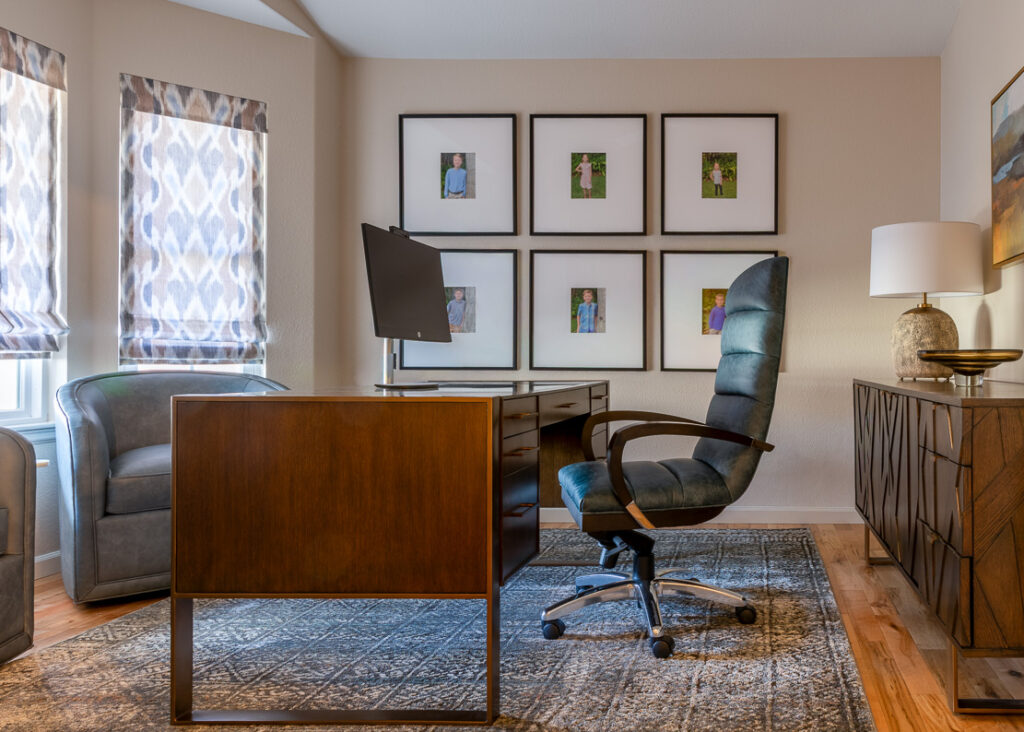 Custom home office with built-in desk and gallery wall Lone Tree Colorado