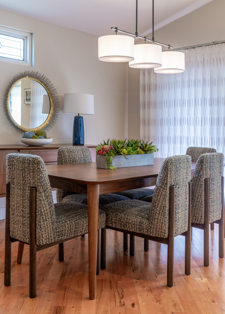 Dining room with custom furnishings and statement lighting Lone Tree Colorado