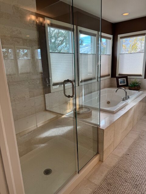 Outdated primary bathroom before renovation with oversized jacuzzi and dated finishes Littleton Colorado