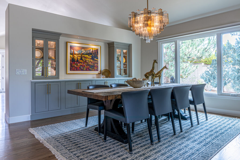 Dining room with enlarged window custom lighting and built-in buffet Greenwood Village Colorado Denver Design Group