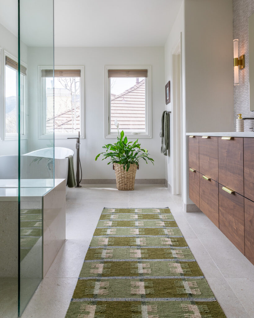 Full primary bathroom remodel with large format Porcelanosa tile and custom walnut floating vanity Littleton Colorado Denver Design Group