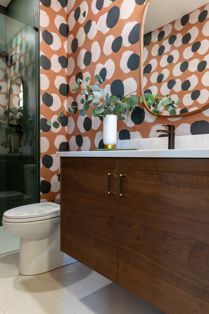 Bold bathroom remodel with Spoonflower terracotta wallpaper and Fireclay green tile Littleton Colorado Denver Design Group