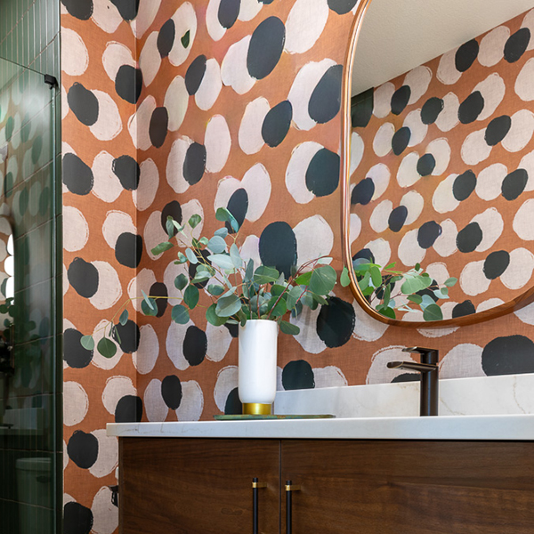 Bold bathroom remodel with Spoonflower terracotta wallpaper and Fireclay green tile Littleton Colorado Denver Design Group