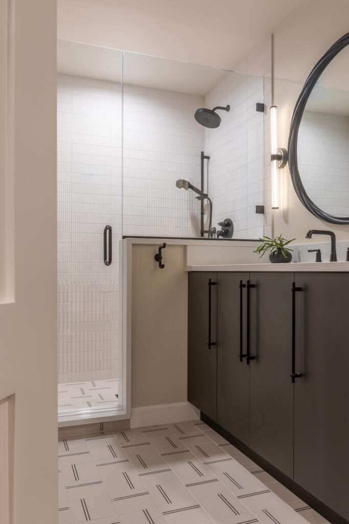 Updated bathroom vanity with warm lighting and refined finishes Greenwood Village Colorado Denver Design Group